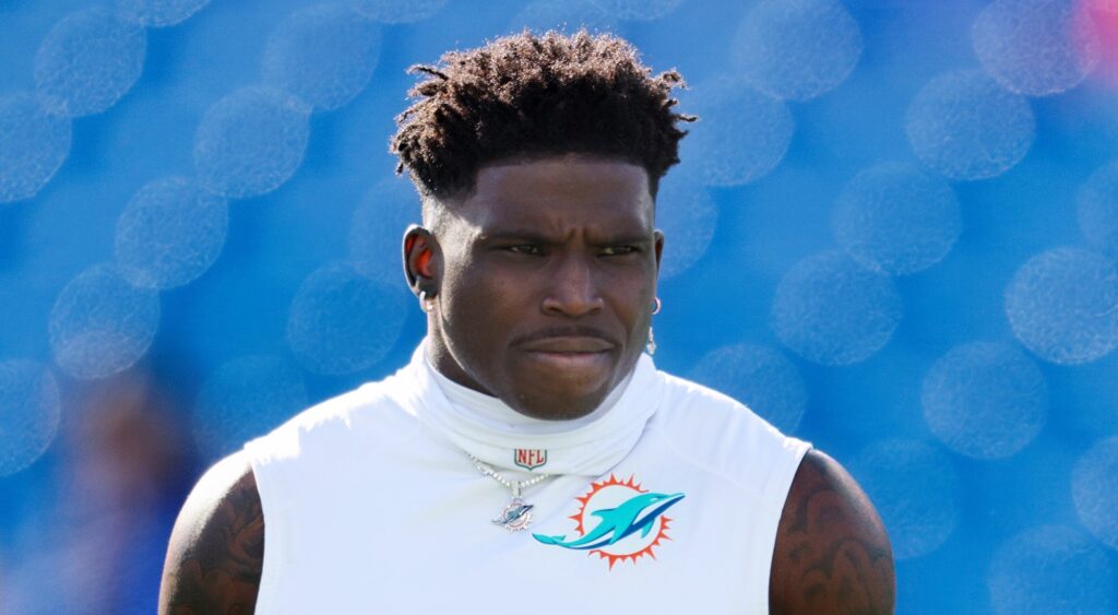 Tyreek Hill of Miami Dolphins looking on.