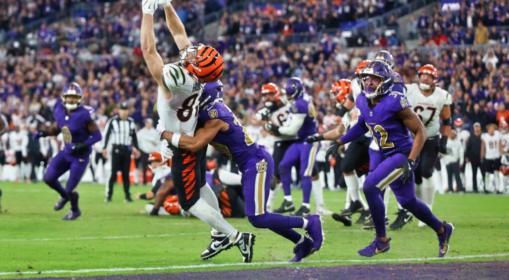 Bengals and Ravens players on field