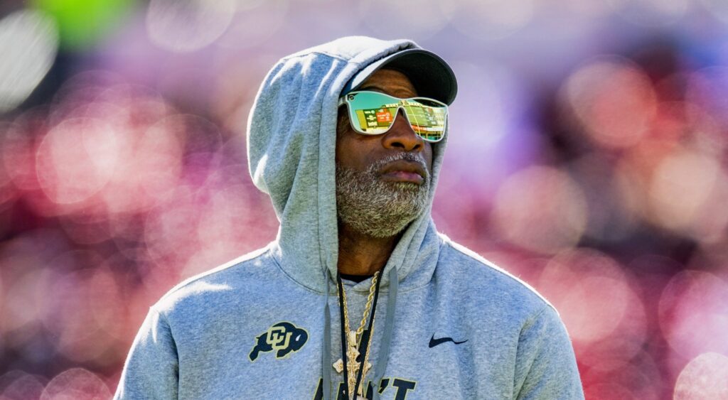 Colorado Buffaloes head coach Deion Sanders looking on.