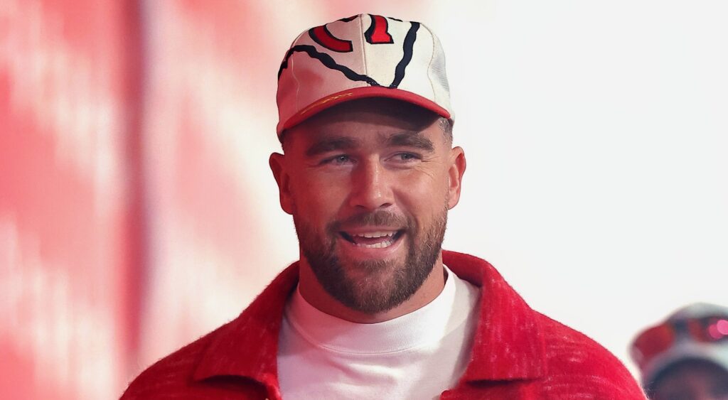 Travis Kelce smiling in Chiefs gear