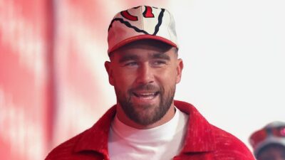 Travis Kelce smiling in Chiefs gear