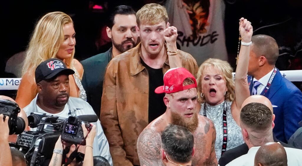 Logan Paul and Jake Paul in boxing ring