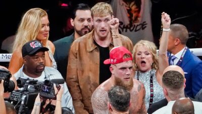 Logan Paul and Jake Paul in boxing ring