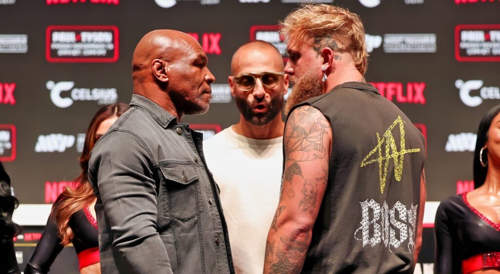 Mike Tyson and Jake Paul looking at each other