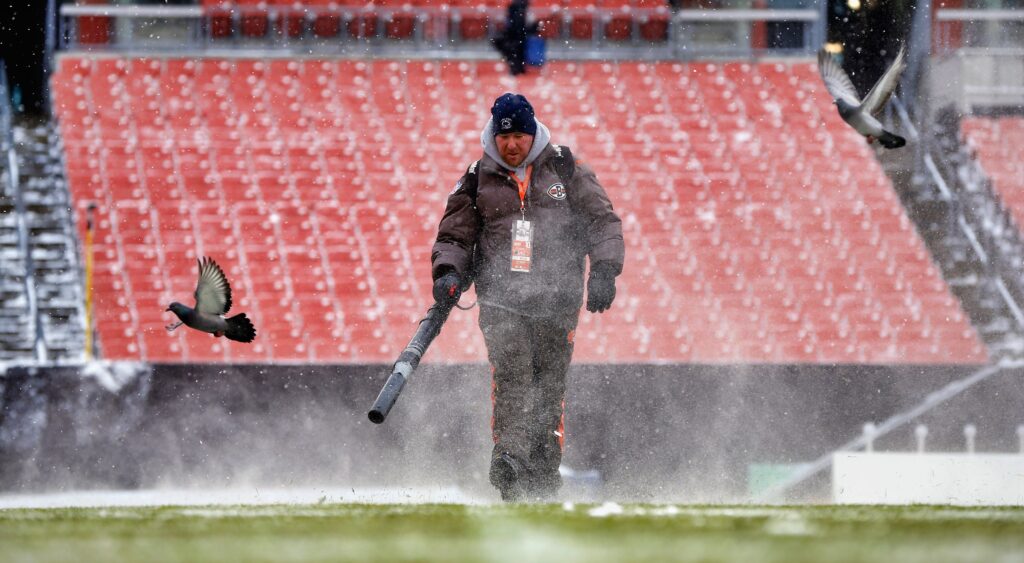 Working cleaning the snow before a cleveland browns game.