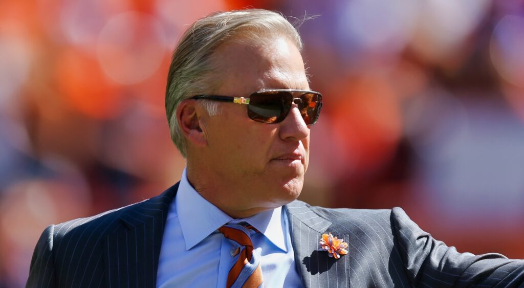 John Elway of Denver Broncos looking on.