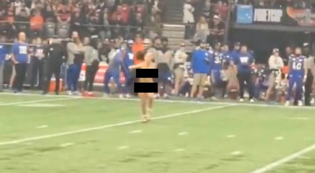 Grey Cup streaker running across the field.