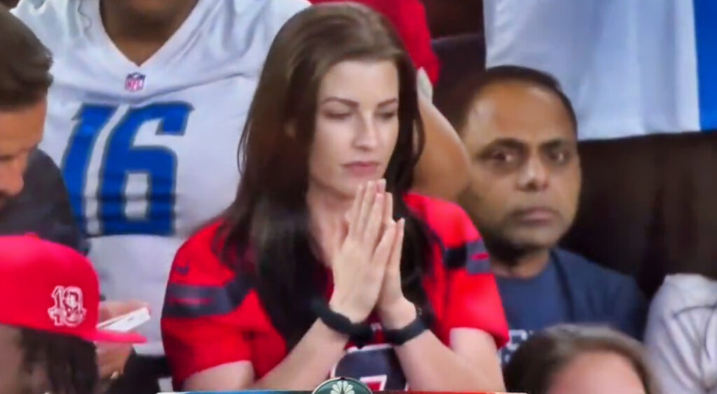 Houston Texans fan in a praying gesture