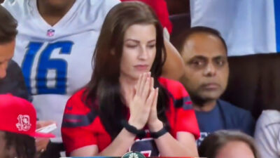 Houston Texans fan in a praying gesture