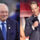 Jerry Jones smiling and Peyton Manning on stage at the CMAs