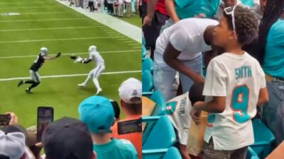 Jonnu Smtih catching a football and his family in the stands