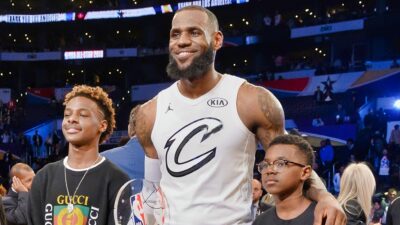 LeBron James Jr., LeBron James and and Bryce Maximus James pose for a photo with the All-Star Game MVP trophy during the NBA All-Star Game 2018