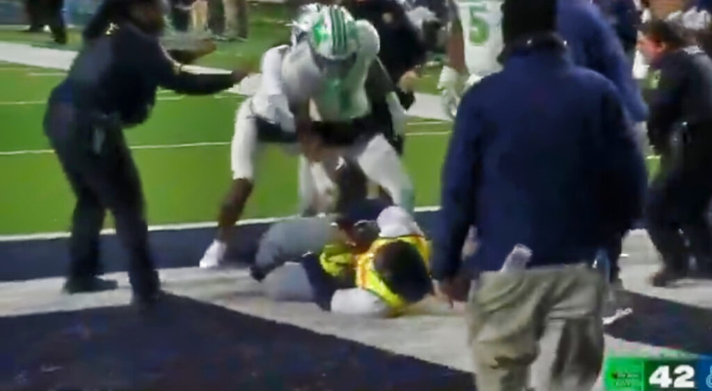 Marshall Thundering Herd players scrapping with cameraman