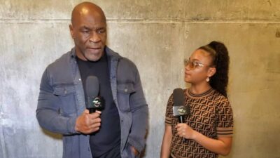 Mike Tyson spaking to teenage reporter