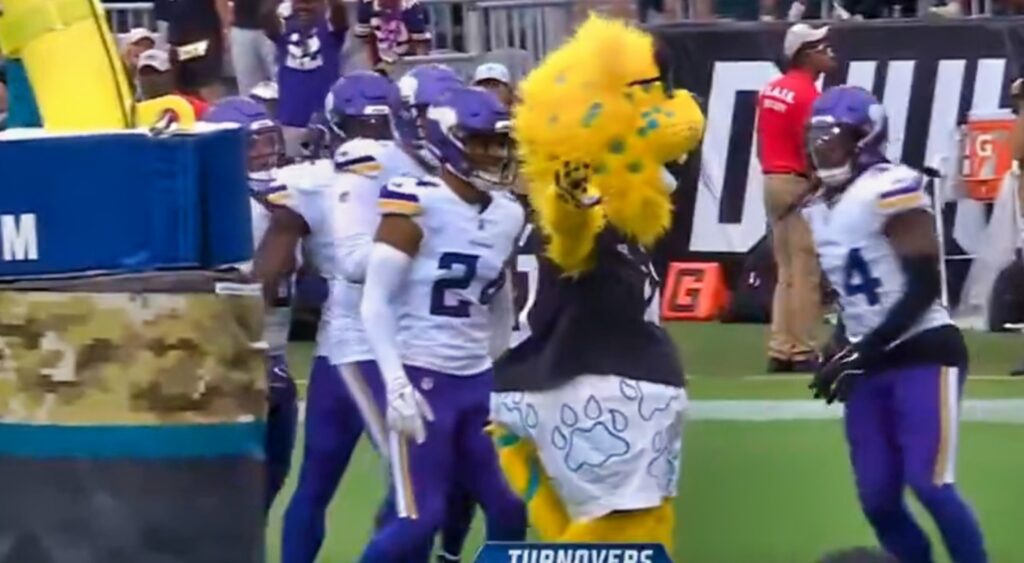 Minnesota Vikings and Jaguars mascot in end zone