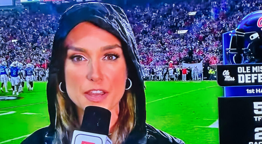 Molly McGrath holding a mic