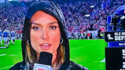 Molly McGrath holding a mic