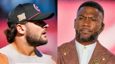 Nick Bosa in 49ers cap and Ryan Clark on set