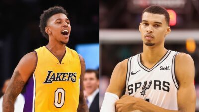 Nick Young of the Los Angeles Lakers reacts to Victor Wembanyama of San Antonio Spurs