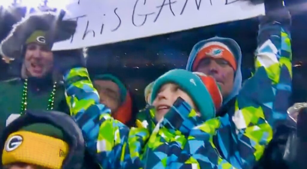 Dolphins fan holding his sign