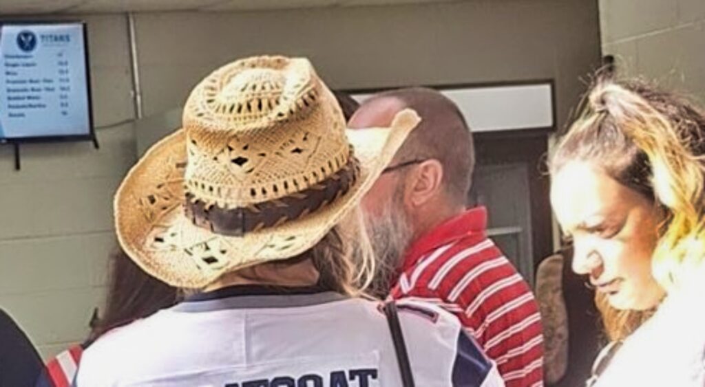 New England Patriots fan with her jersey on.