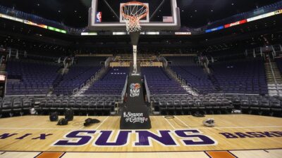 The Phoenix Suns logo is seen on the court before an NBA game