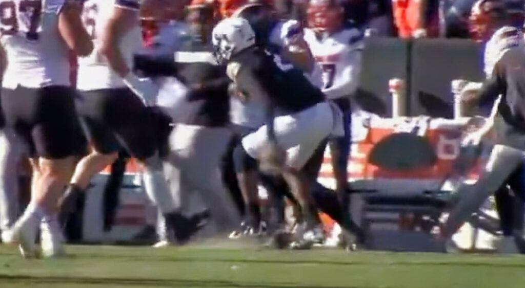 Shedeur Sanders gets tackled by Oklahoma State defender