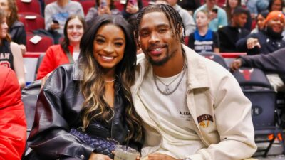 Olympic Gold medalist Simone Biles and Jonathan Owens of Chicago Bears pose for a photo during the first half between the Chicago Bulls and the Minnesota Timberwolves at the United Center on November 07, 2024 in Chicago, Illinois.