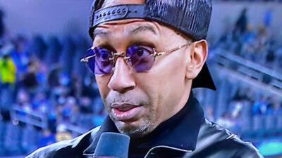 Stephen A Smith speaming into mic