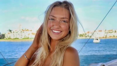 Sydney Thomas posing in bikini on boat