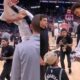 Victor Wembanyama after an NBA match gives his jersey to a young boy