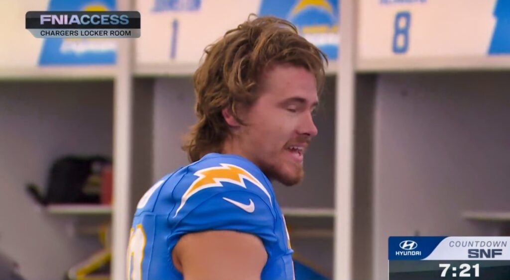 Justin Herbert of Los Angeles Chargers speaking in locker room.