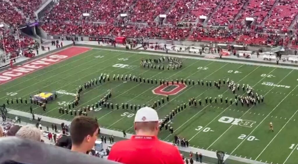 Ohio State Buckeyes marching band on field.