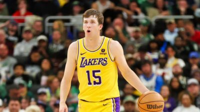 Austin Reaves of the Los Angeles Lakers handles the ball during a game against the Milwaukee Bucks at Fiserv Forum on March 26, 2024 in Milwaukee, Wisconsin.