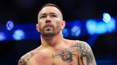 Colby Covington of the United States enters the octagon for a welterweight title fight against Leon Edwards of England during the UFC 296