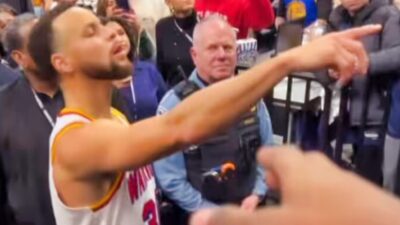 Stephen Curry angrily reacts after an elderly man snatches shoes he gifted to a little kid