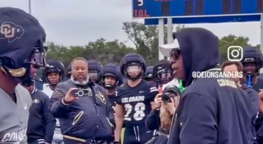 Deion Sanders and Travis Hunter  at practice