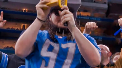 Detroit Lions fan grating cheese