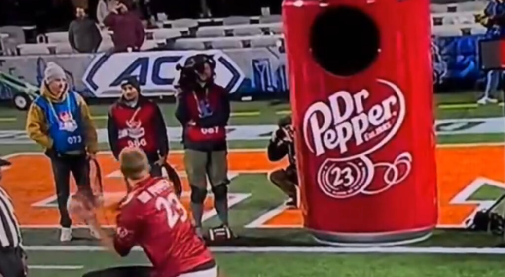 Participant throwing at the Dr. Pepper Halftime challenge