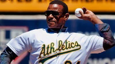 Ricky Henderson throwing first pitch before A's game