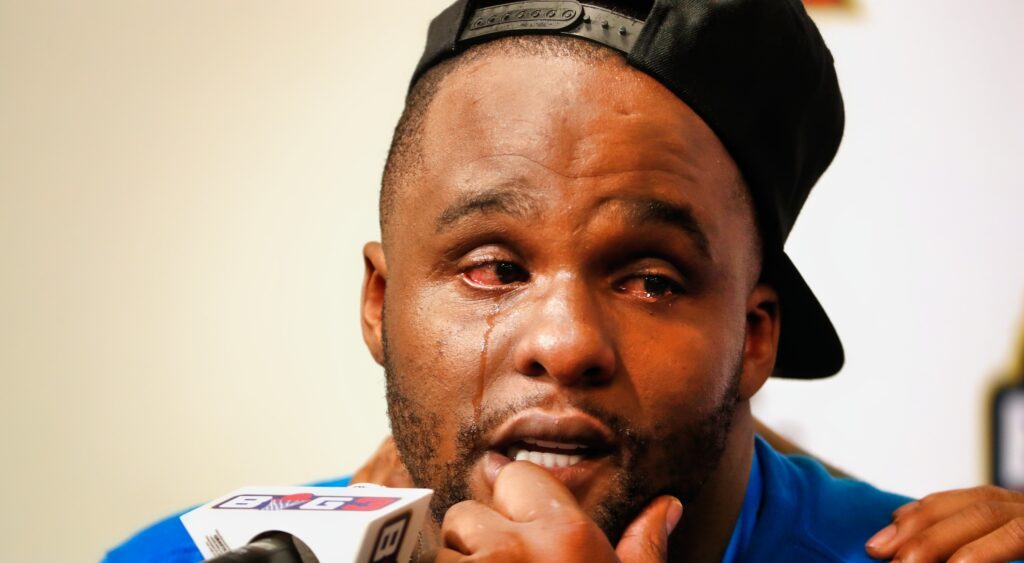 Glen Davis cries during a press conference.