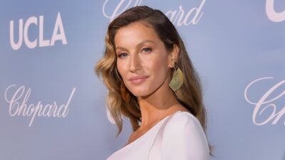 Gisele Bundchen posing in white outfit