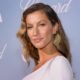 Gisele Bundchen posing in white outfit