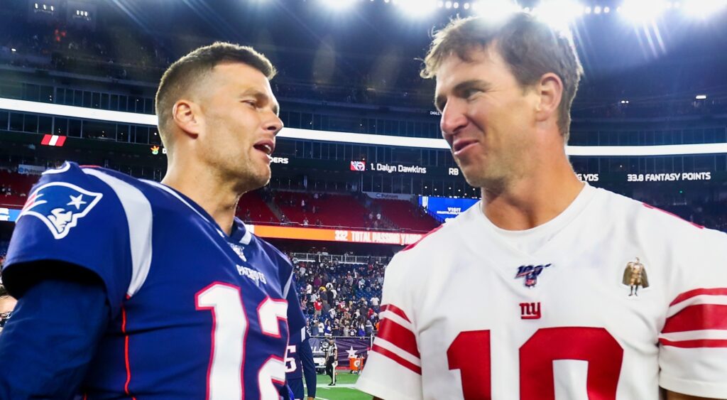 Tom Brady and Eli Manning talking after game.