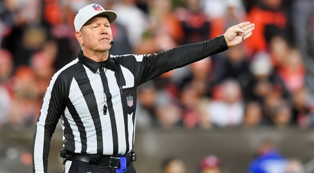 NFL Ref signaling penalty during a Lions game