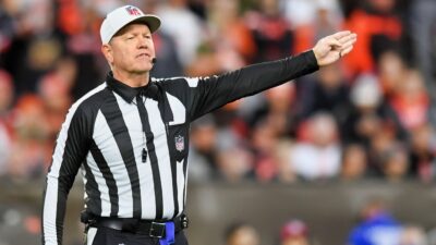 NFL Ref signaling penalty