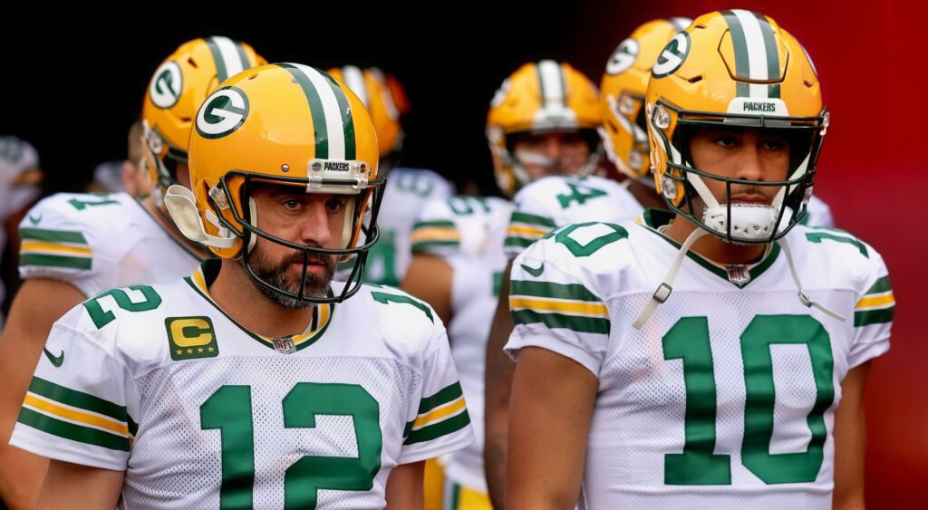 Aaron Rodgers and Jordan Love looking on.