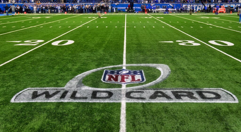 NFL playoffs logo shown on field.