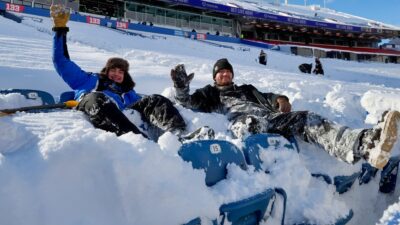 Fans inside Highmark stadium with snow on seats