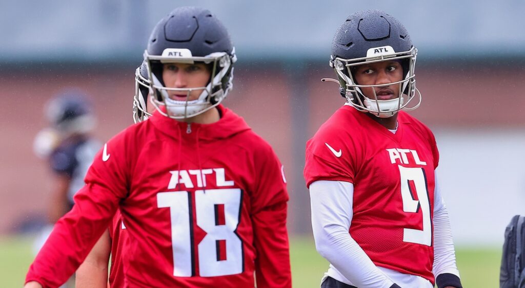 Kirk Cousins and Michael Penix Jr. look on at practice.